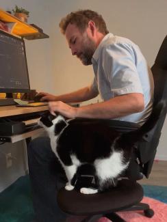 Image of Paul and JoJo the cat using the sit cat chair