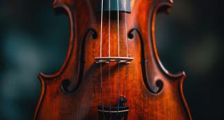 close-up of violin on dark background
