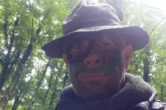 Paolo Visonà during a solo reconnaissance of the wall that indicated the Roman army line. He is wearing camouflage paint to avoid being seen by potential looters. Photo provided by Paolo Visonà.