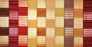 warm reds, oranges, golds, and brown in woven pattern art by Catherine Ellis