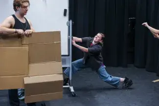 Students rehearse for the fall touring company in the black box theatre 