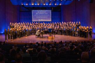 singers on stage with pianist at piano center downstage