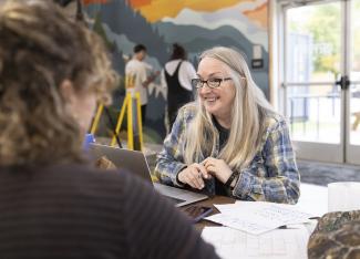 Lee Ann Paynter smiling at student
