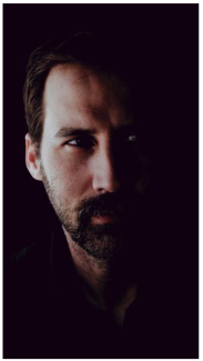 blake burton headshot on dark background