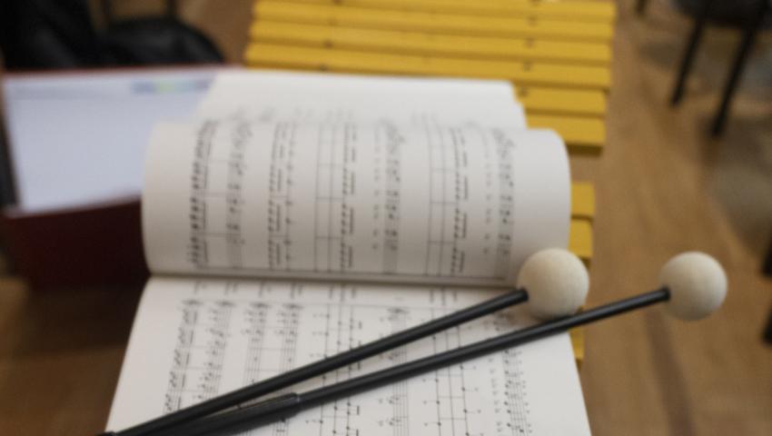 two mallets on sheet music
