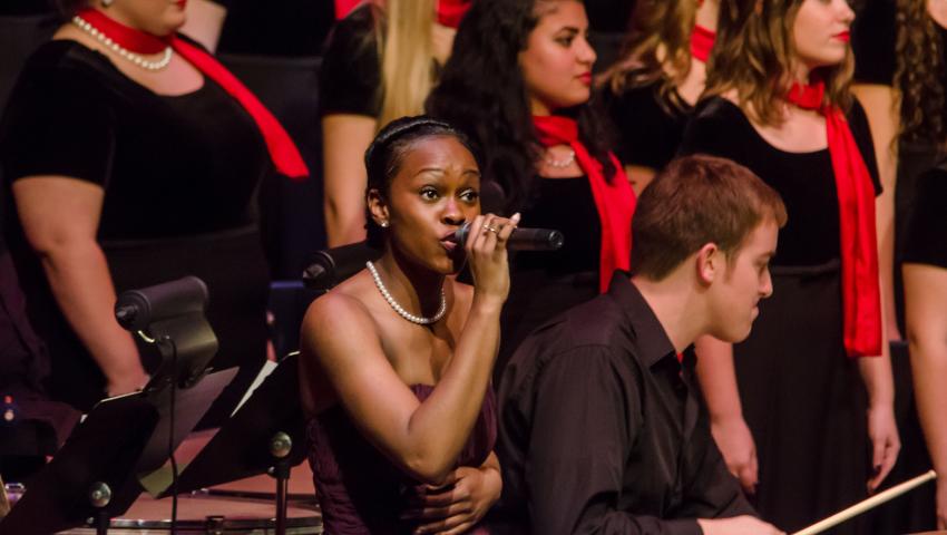 students singing with red scarf