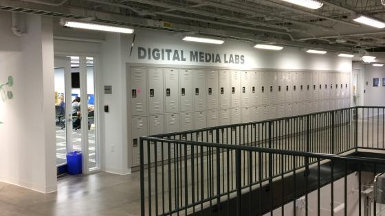 The entrance to one of the second floor labs is available by a wall of lockers along a balcony.
