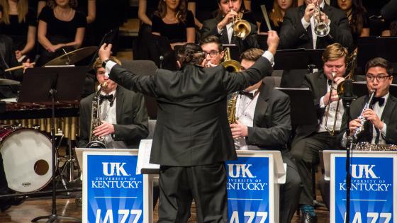 jazz students performing on stage with conductor in front