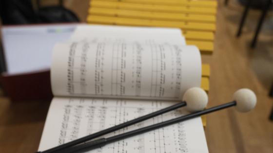 two mallets on sheet music