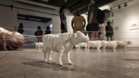 art sculpture of farm animals on floor of gallery