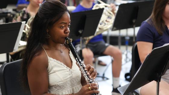 student playing oboe