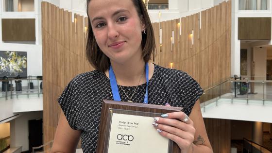 Image of Ashleigh Jones holding her awards inside a hotel at the MediaFest 2025