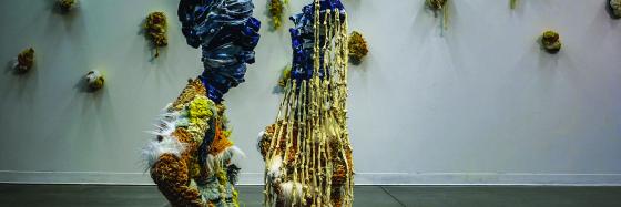 sculptures of two women in gallery