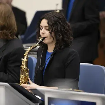 student playing saxophone