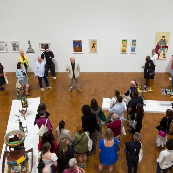 many people in art museum during reception