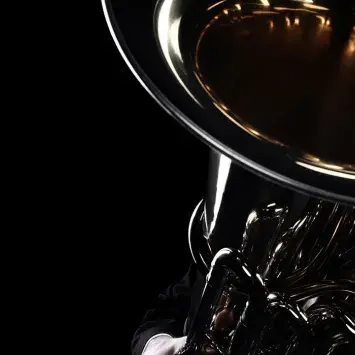 brass instrument on black background