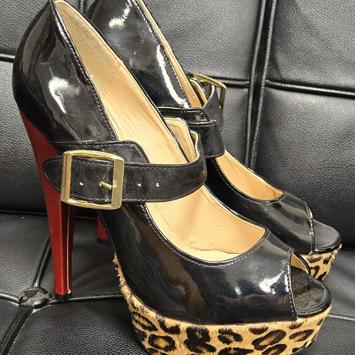 Image of black platform high heels with leopard wedge and red heel