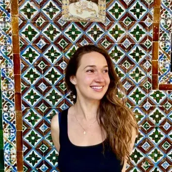 sophia kitlinski looking away from camera on printed background