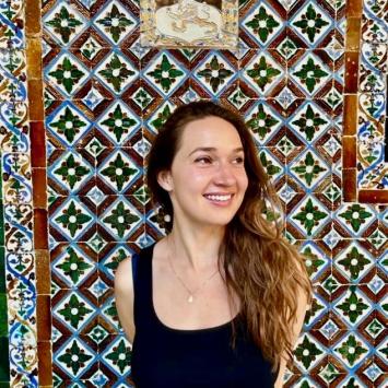 sophia kitlinski looking away from camera on printed background