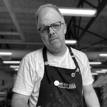 black and white image of david wischer looking at camera