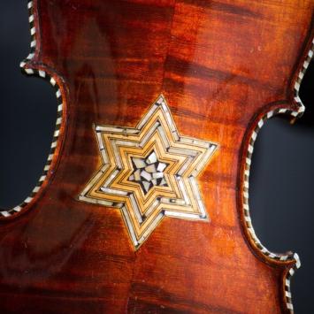 violin with star of david on front