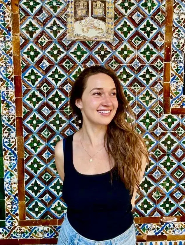 sophia kitlinski looking away from camera on printed background