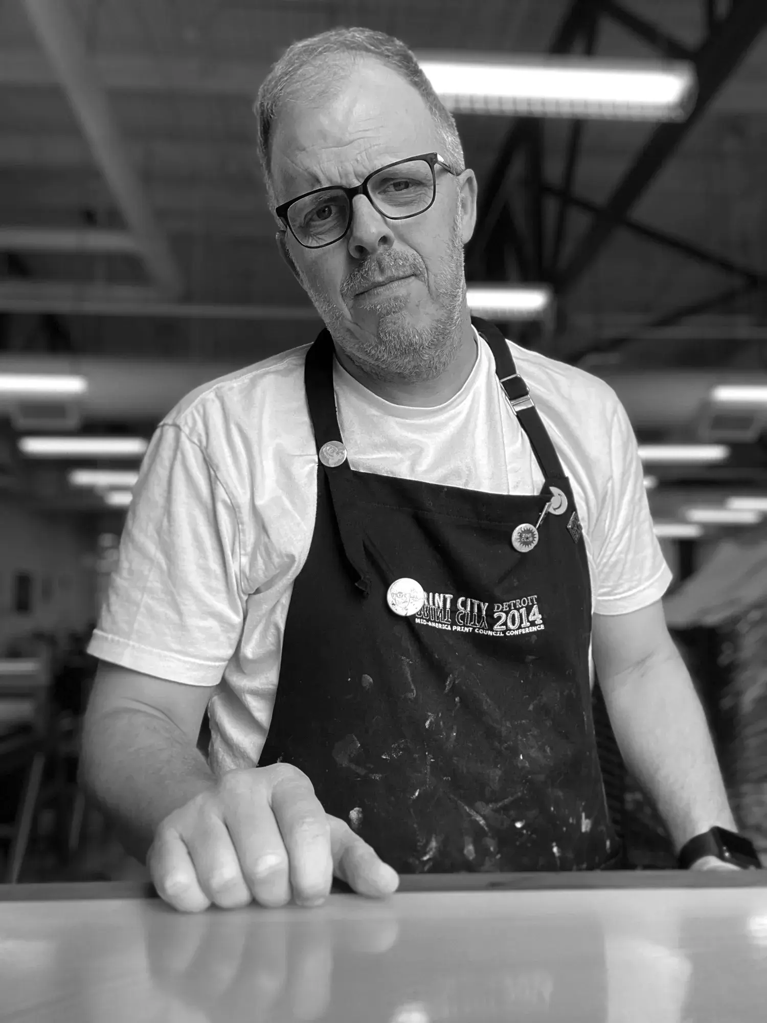 black and white image of david wischer looking at camera