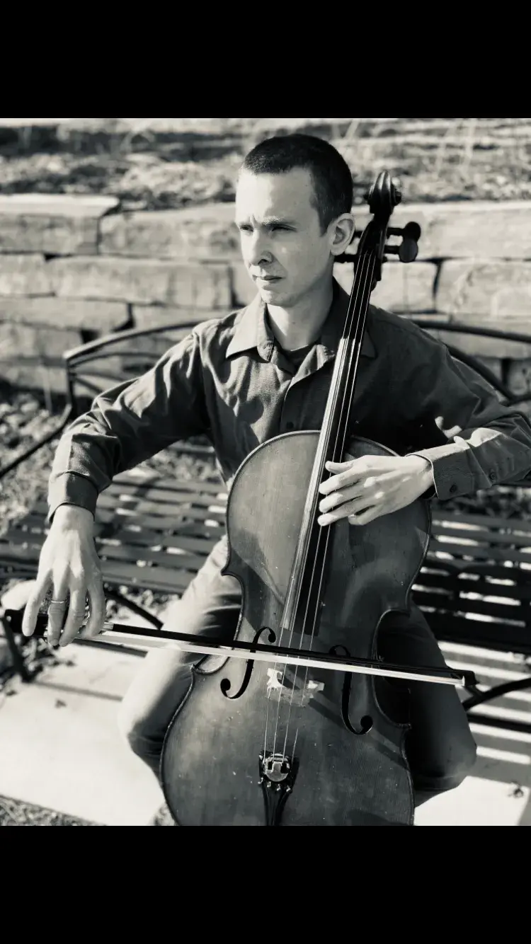 ethan young posing with cello